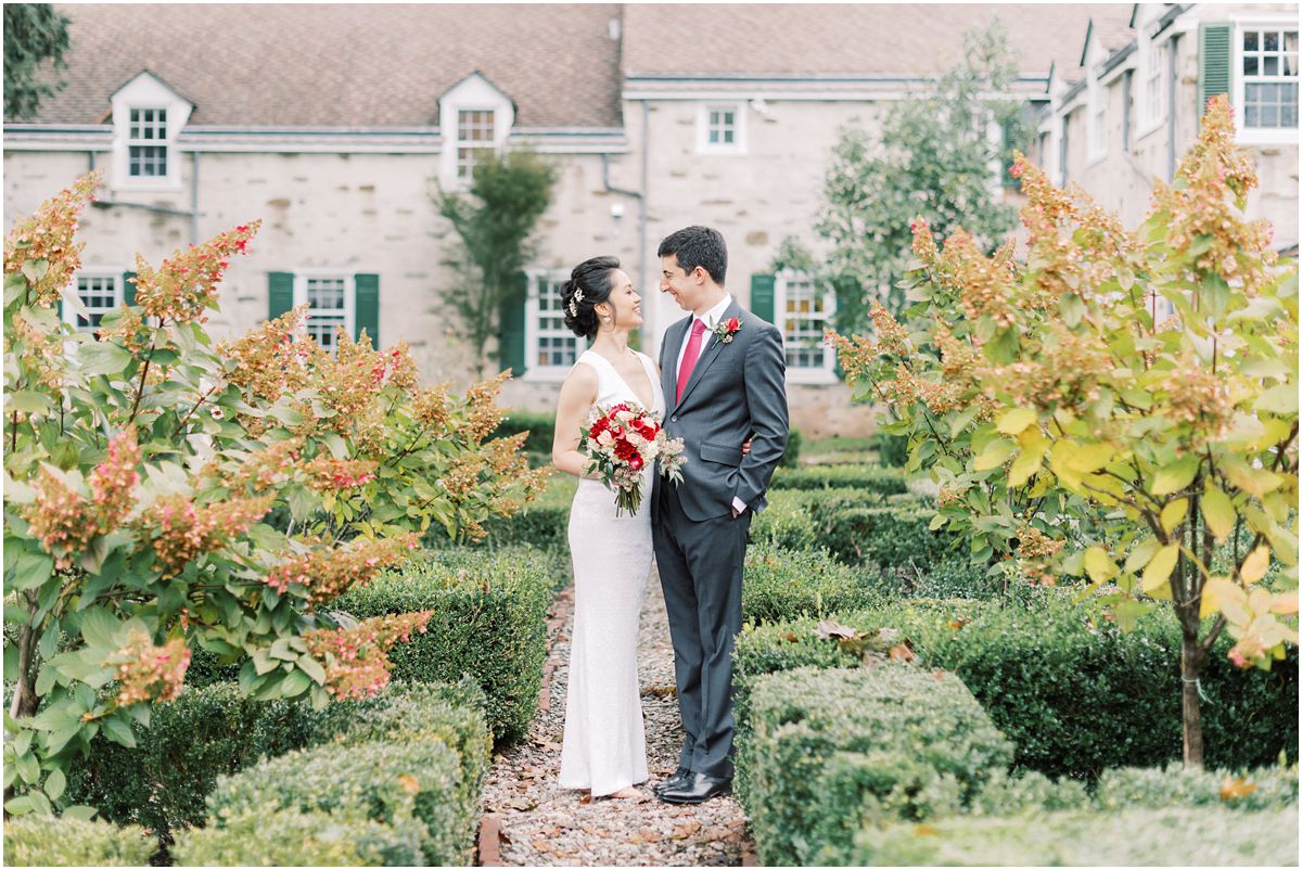 Bride and groom in courtyard during fall Appleford Estate wedding