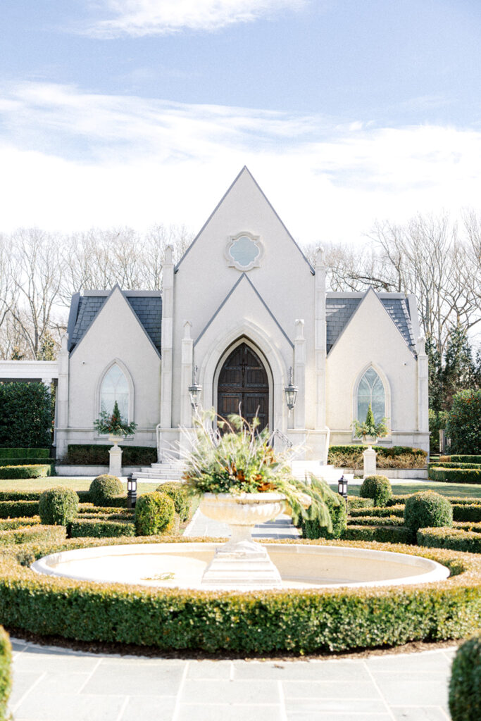 Exterior photo of the ceremony chapel and gardens at French style Park Chateau wedding venue in New Jersey | Photo by Lindsey Ford Photography