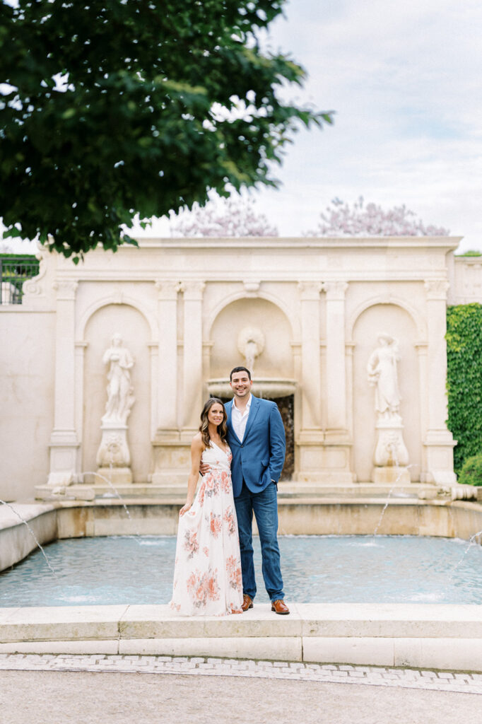 Couple poses in front of main garden foundation in Longwood Gardens | Longwood Gardens Engagement Photo Session in Philadelphia by Lindsey Ford Photography