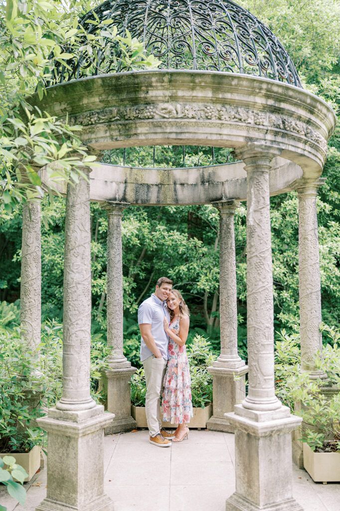 Couple poses under pergola at Longwood Gardens | Longwood Gardens Engagement Photo Session in Philadelphia by Lindsey Ford Photography