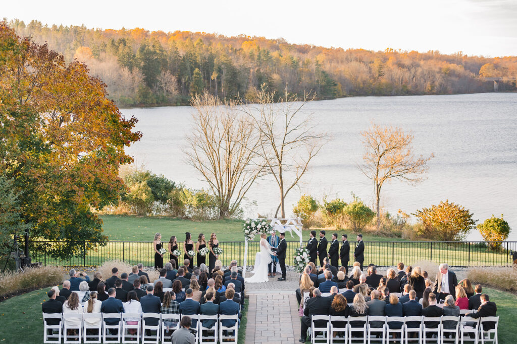 Outdoor wedding ceremony overlooking the lake at the Lake House inn wedding venue