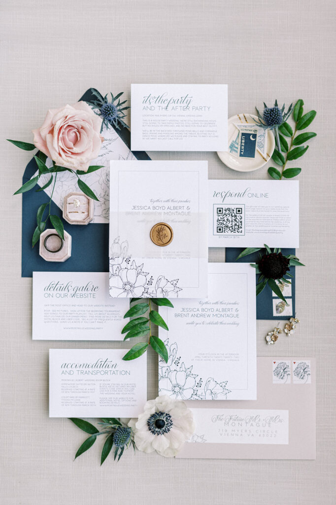 White and blue wedding invitation suite flatlay