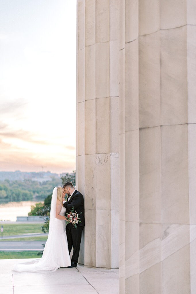 Couple poses at Lincoln Memorial for Washington DC Elopement photos