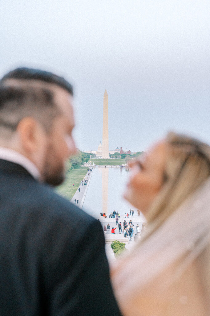 Couple poses at Lincoln Memorial for Washington DC Elopement photos