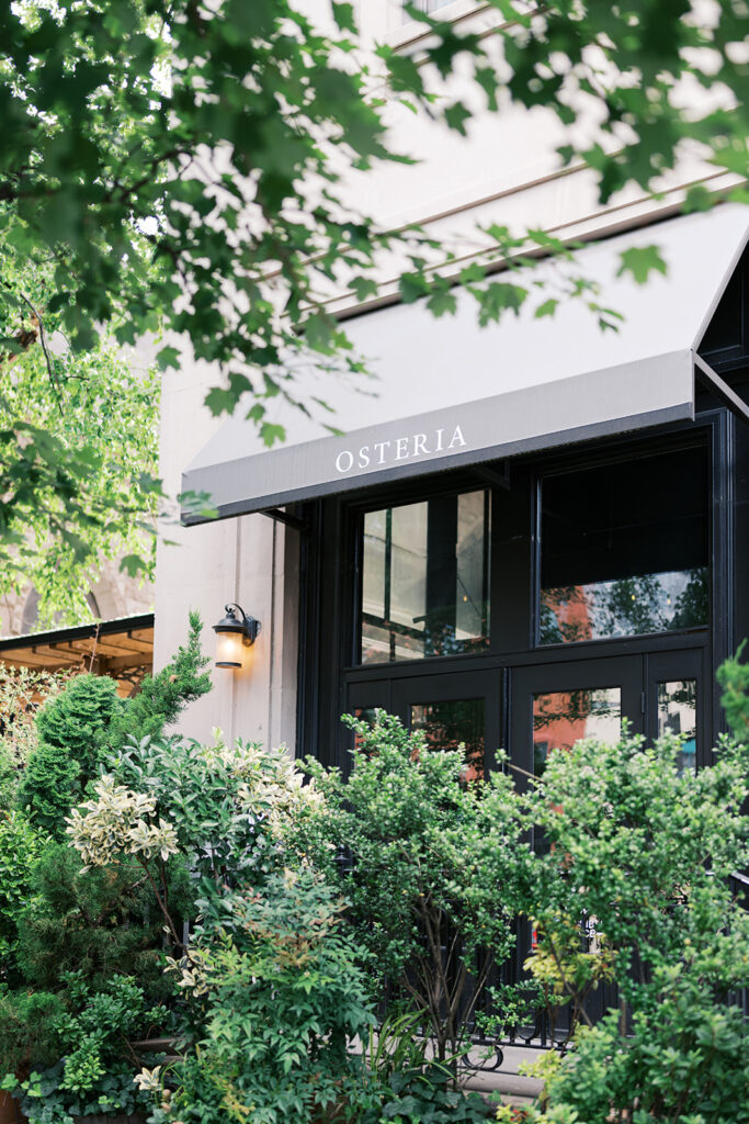 Awning over black trim window that reads Osteria | Lindsey Ford Photography in Philadelphia