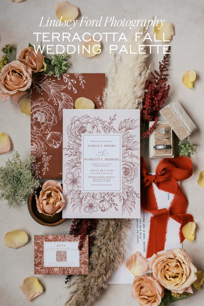Terracotta fall wedding invitation suite with dusty rose flowers and pampas grass flat lay