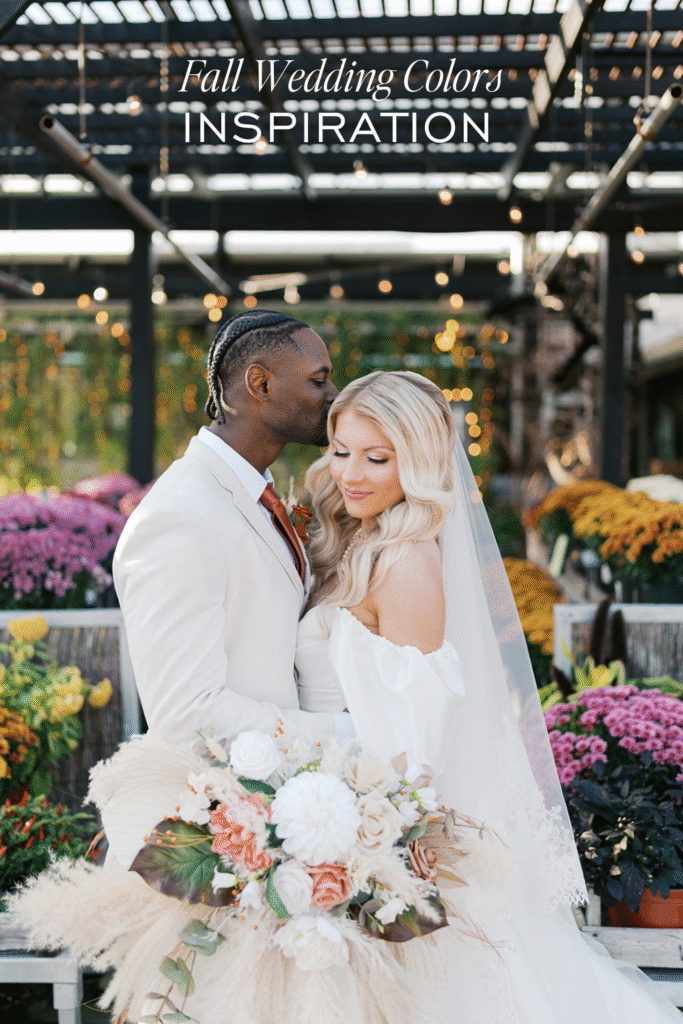 Fall wedding couple embraces during golden hour at Terrain Gardens with mums and string lights