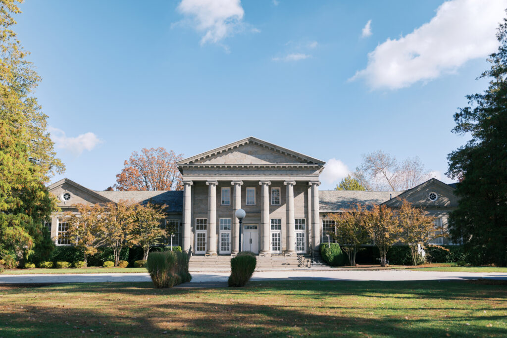 Exterior of elegant wedding venue with stone pillars | The Ballroom at Ellis Preserve