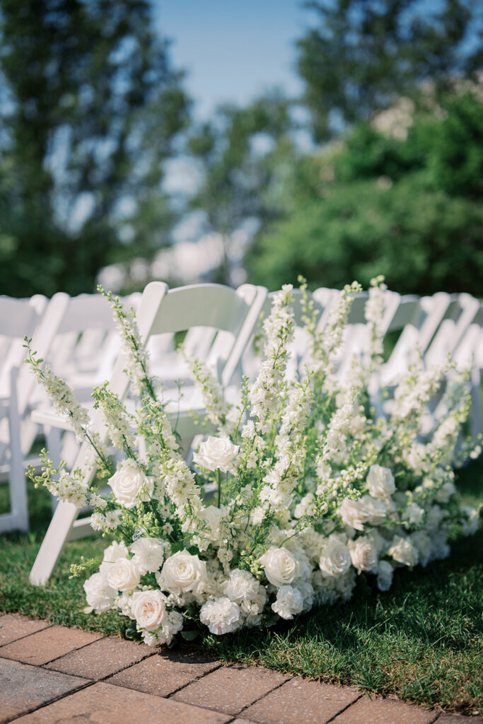 White floral ceremony arrangements at Lake House Inn Perkasie Pennsylvania wedding venue