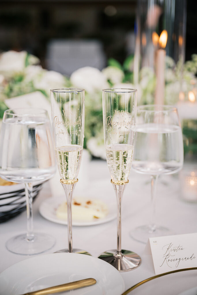 Personalized champagne flutes wedding detail with Mr and Mrs engraving elegant gold reception table Lake House Inn