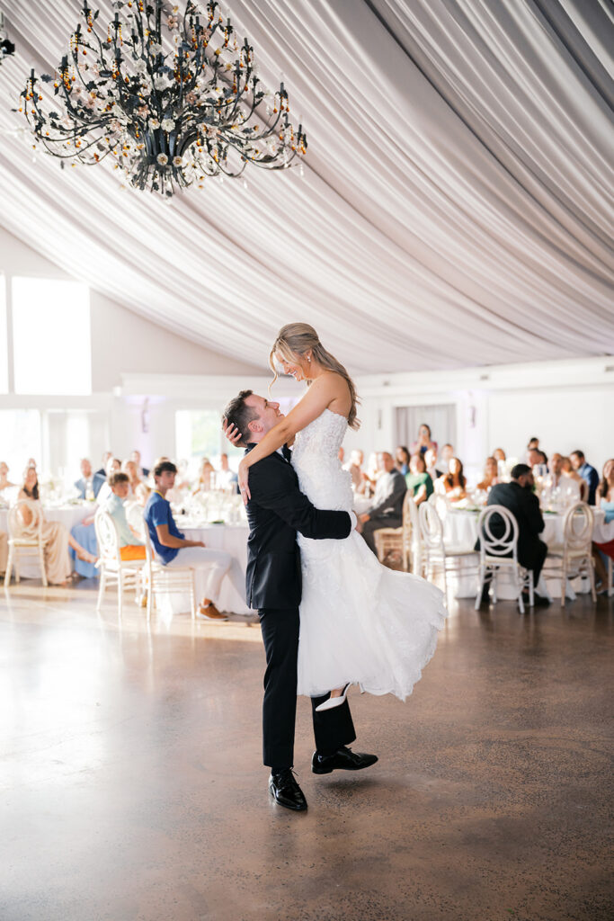Romantic first dance lift nontraditional wedding pictures Lake House Inn pavilion reception with crystal chandelier Pennsylvania