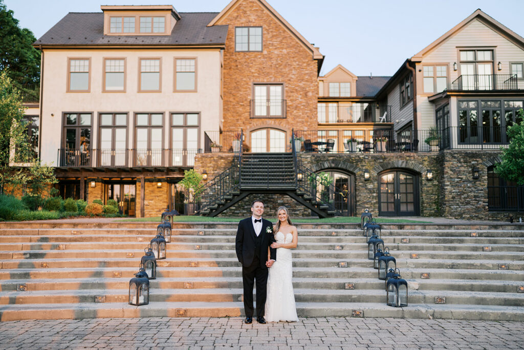 Elegant Lake House Inn pavilion exterior couple portrait on grand staircase with lanterns Pennsylvania wedding venue