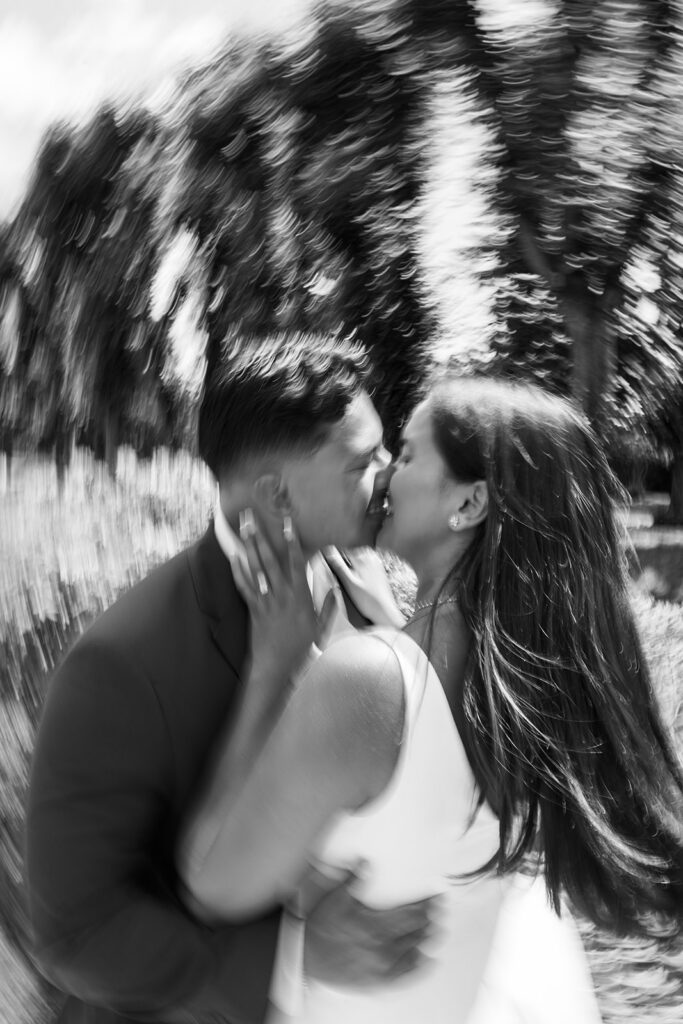 Black and white couples photography artistic blur close-up couple about to kiss with engagement ring detail at Nemours Estate Delaware